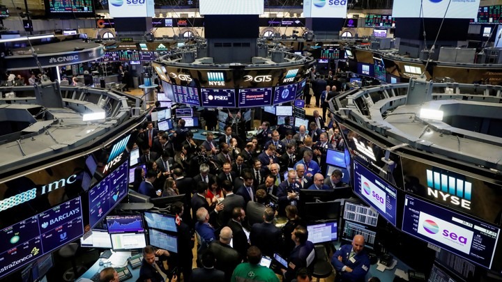 Traders gather for the IPO of Singapore-based Sea Limited on the floor of the NYSE in New York